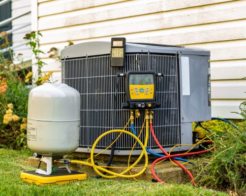 An,Old,Air,Conditioning,Unit,That,Is,Being,Repaired,By An,Old,Air,Conditioning,Unit,That,Is,Being,Repaired,By